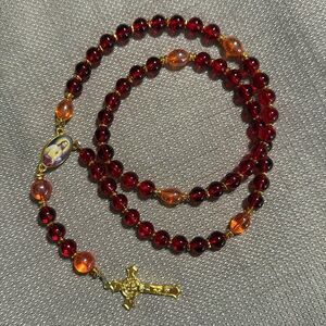 Handmade Rosary. Red and orange glass beads and gold metal pieces.